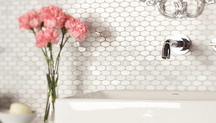 white oval wall tile used behind a sink in bathroom